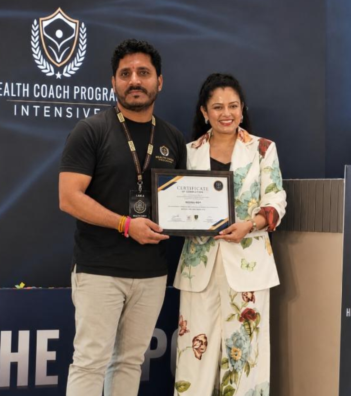 Neeraj Roy receiving his Health Coach Program certificate